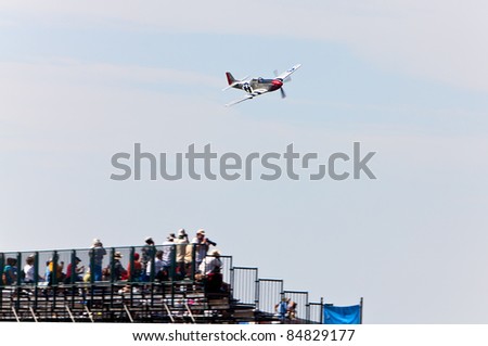 YPSILANTI, MI - JULY 24 : A P-51 Mustang makes a low pass over the grandstands at the Thunder Over Michigan air show on July 24, 2011 in Ypsilanti, Michigan.