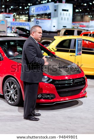 CHICAGO - FEB 9: A Mopar executive talks about the customizations to a Dodge Dart at the 2012 Chicago Auto Show Media Preview on February 9, 2012 in Chicago, Illinois.