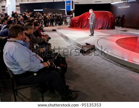 CHICAGO - FEB 8: Members of the media await the unveiling of the 2013 GMC Acadia at the 2012 Chicago Auto Show Media Preview on February 8, 2012 in Chicago, Illinois.