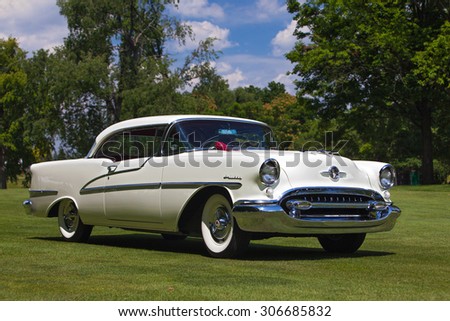 PLYMOUTH - JULY 26: A vintage Oldsmobile Holiday on display July 26, 2015 at the Councors D\'Elegance in Plymouth, Michigan.