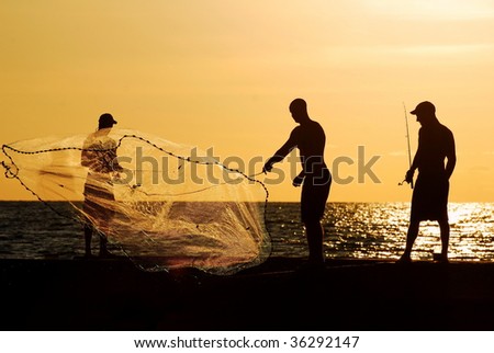 Three men fishing at sunset