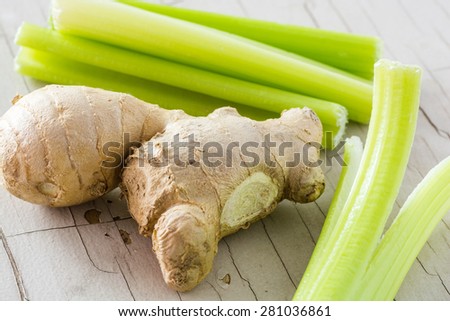 Closeup of ginger root and celery.