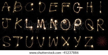 The alphabet spelled out by hand using sparklers at night on long exposure. Can be cropped to spell out any word or message.