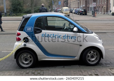 Amsterdam,The Netherlands-march 14,2015: Electric car at a charging station in Amsterdam. Charging it\'s battery