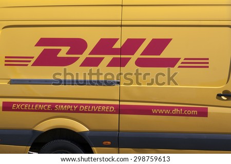 Amsterdam,netherlands-july 21, 2015: DHL side of a car,dhl is  especially active as a courier company for the delivery of parcels and letters