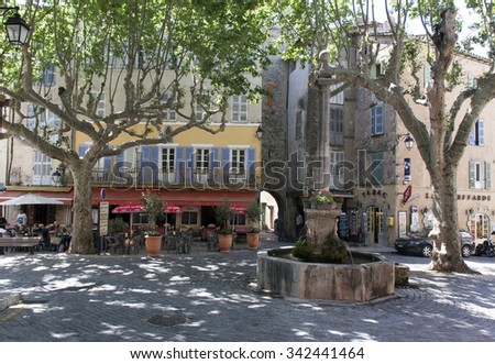 avignon,france-june 24, 2015: tipical french square with platans in avignon france