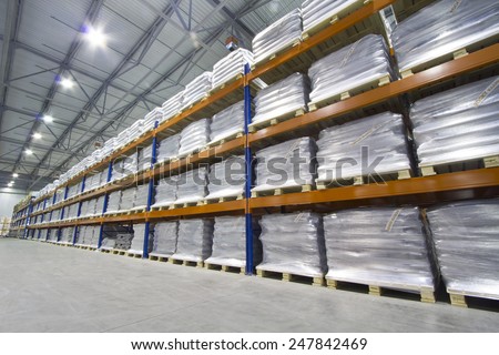 Row of the pallet metal racks with a heavy load in large modern