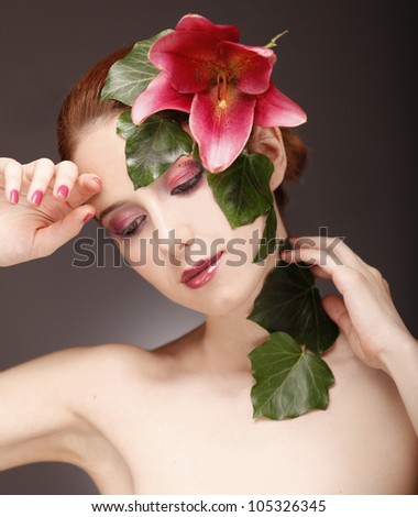 Girl with style makeup and flower.