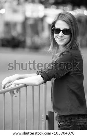 Style girl at the street. Photo in black and white style.