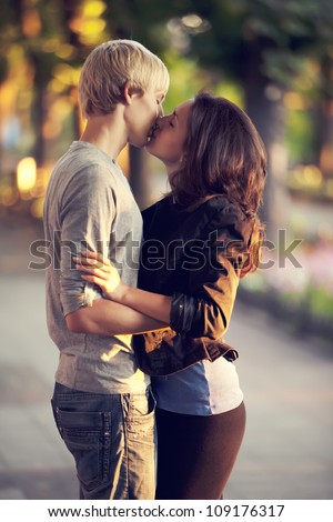 Young couple kissing on the street