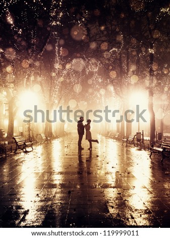 Couple Walking At Alley In Night Lights. Photo In Vintage Style.