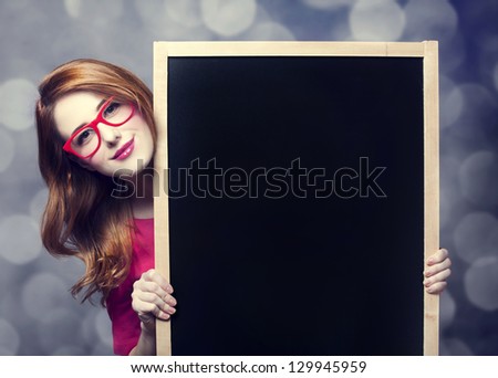 Redhead student with blackboard Redhead student with blackboard