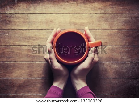 Woman Holding Hot Cup Of Tea