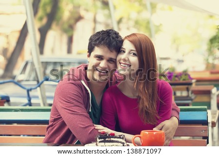 The young man and girl in the cafe