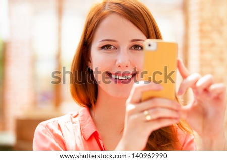 woman using mobile phone.