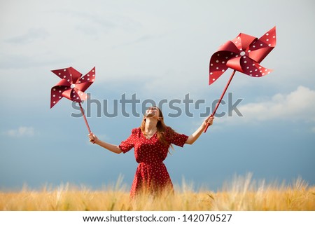 Redhead girl with toy wind turbine