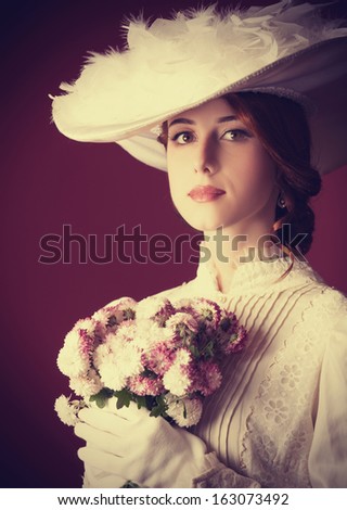 Beautiful redhead women with bouquet