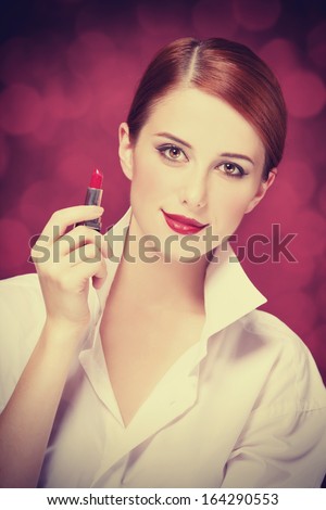 Redhead girl with lipstick