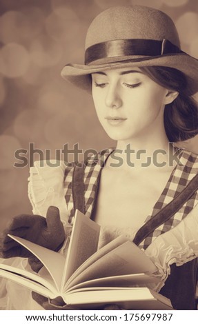 Beautiful women with book. Photo in retro style with bokeh at background.
