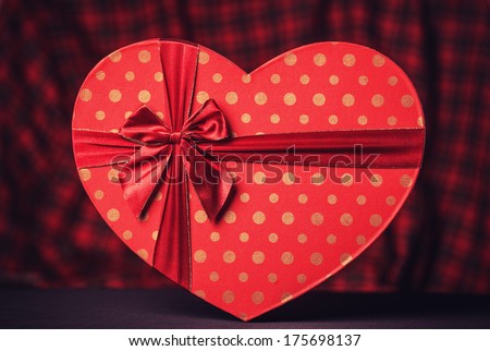 Valentines gift in heart shape. Photo in retro color image style.