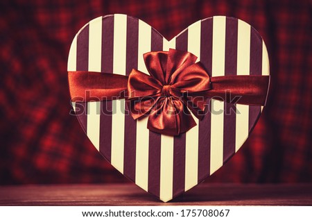 Valentines gift in heart shape. Photo in retro color image style.