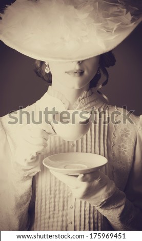 Beautiful Women With Cup Of Tea. Photo In Old Color Image Style.