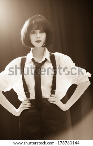 Fashion women with tie. Studio shot with backlight.