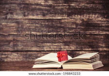 Present box and open book.