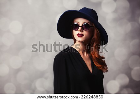 Style redhead women with sunglasses.
