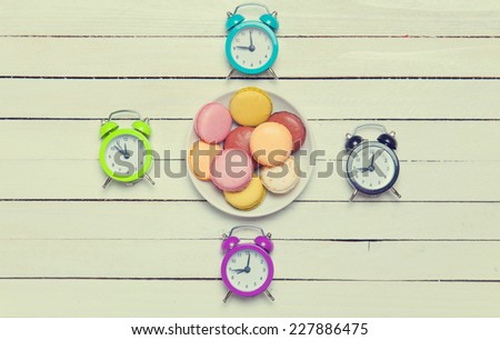 Clock and macaron with christmas toys.