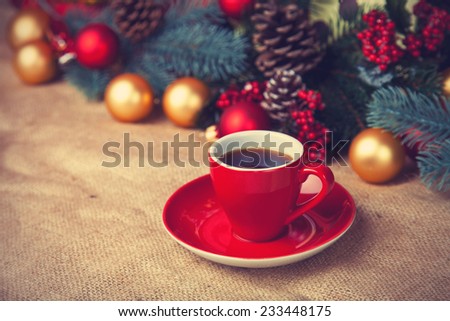 Cup of coffee and christmas gifts.