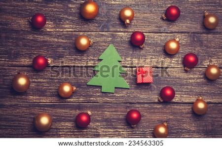 Christmas balls and gift with tree shape toy.
