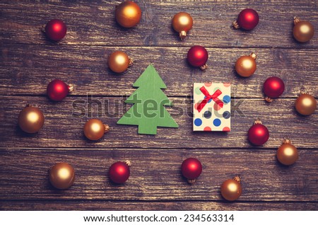 Christmas balls and gift with tree shape toy.