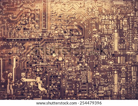 Old printed circuit board. Photo in old color image style.