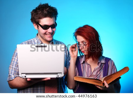Girl with old book and boy with notebook