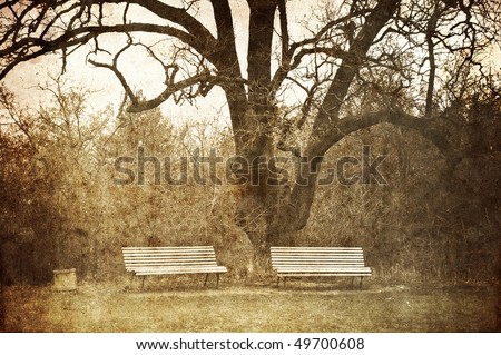 Wooden park bench in the park of Massandra castle, Crimea, Ukraine. Photo in old image style.