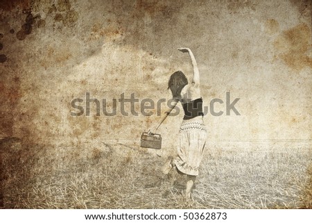 Girl dancing with radio at wheat field road. Photo in old image style.