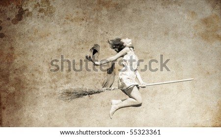 Young red-haired witch on broom flying in the sky. Photo in old image style.