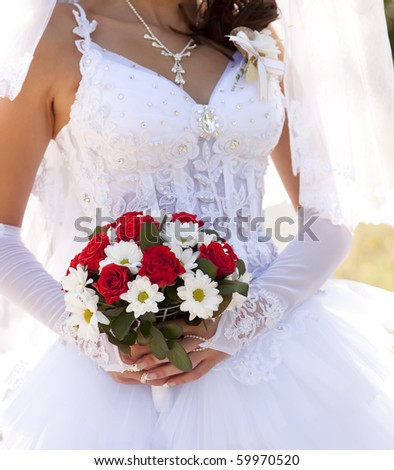 stock photo Bride holding beautiful red roses wedding flowers bouquet