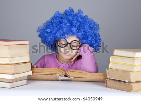 Young blue-haired girl with books. Studio shot.