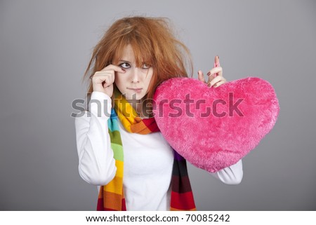 Sad girl with heart. St. Valentine Day