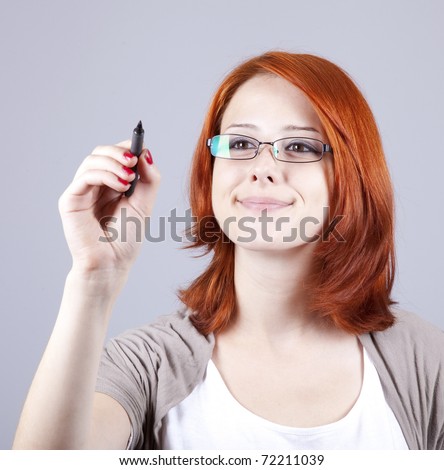 Young businesswomen with pen in hand