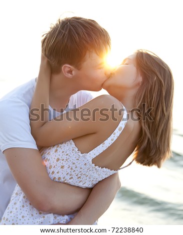 stock photo Couple kissing at sunrise