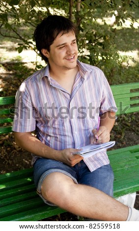 Men with glasses doing homework at the park.