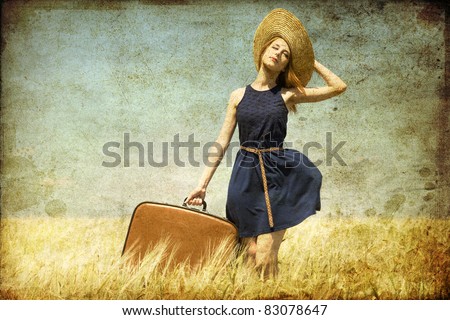 Lonely girl with suitcase at country. Photo in old color image style.