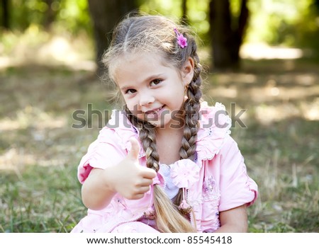 Cute little girl at outdoor in fall.