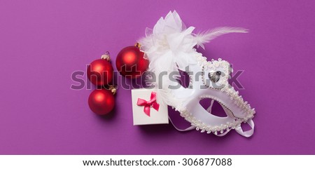 White mask and girl box on violet background.