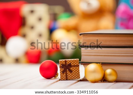 Books with christmas gifts on background