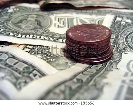 Quarters on dollar bill