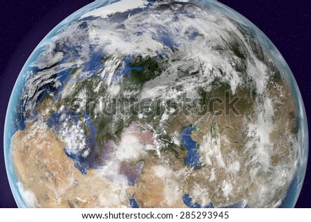 Planet Earth; the Earth from space showing Europe, Asia and Africa on globe in the day time with clouds; elements of this image furnished by NASA